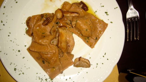 Sant’Egidio style chestnut Ravioli filled with ricotta and sprinkled with mint flavored porcini mushroom sauce