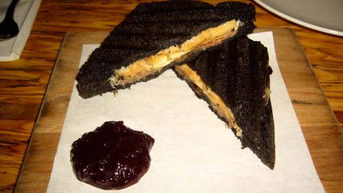 The Fois Gras Black Croque-Monsieur with Ham, Cherry and Amaretto is creamy, rich and delicious.  The perfectly grilled bread gets its color from squid ink.